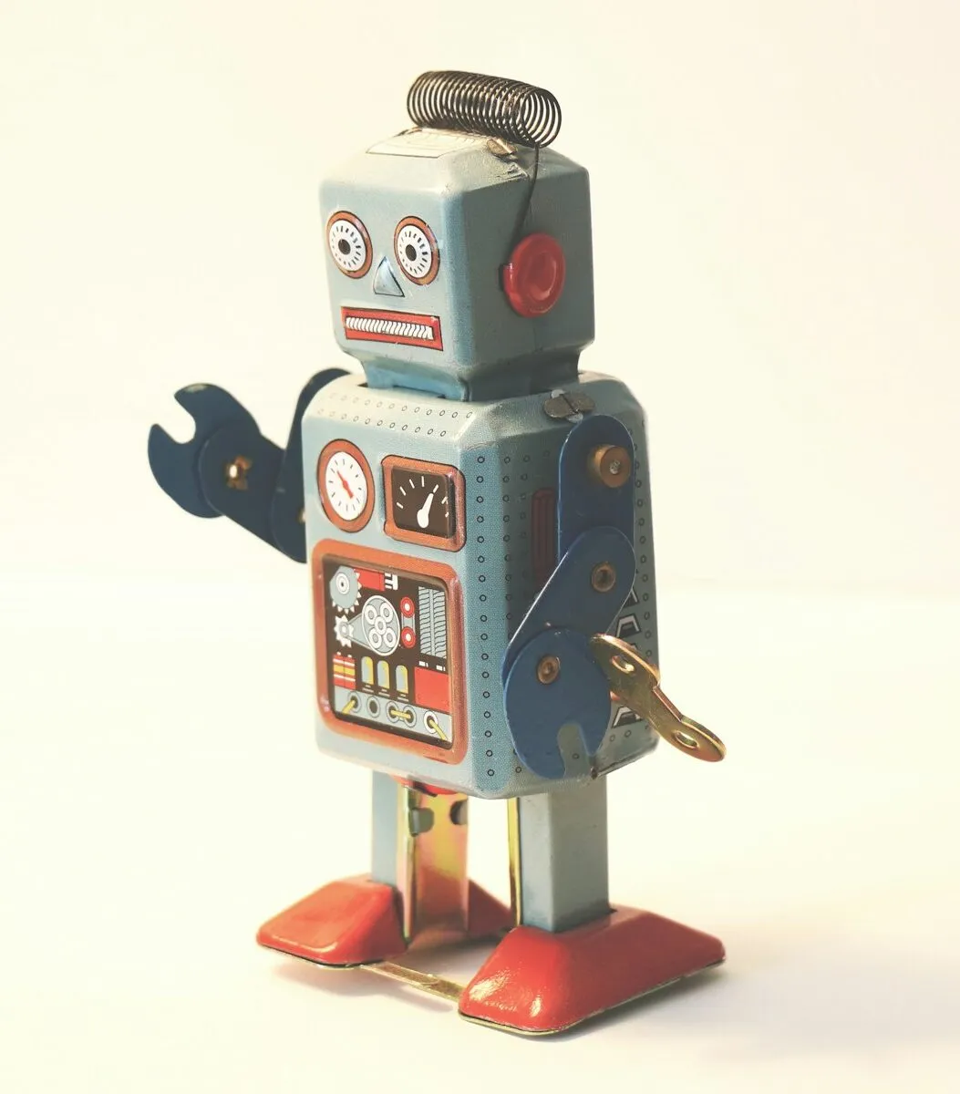 Gray and orange plastic robot toy